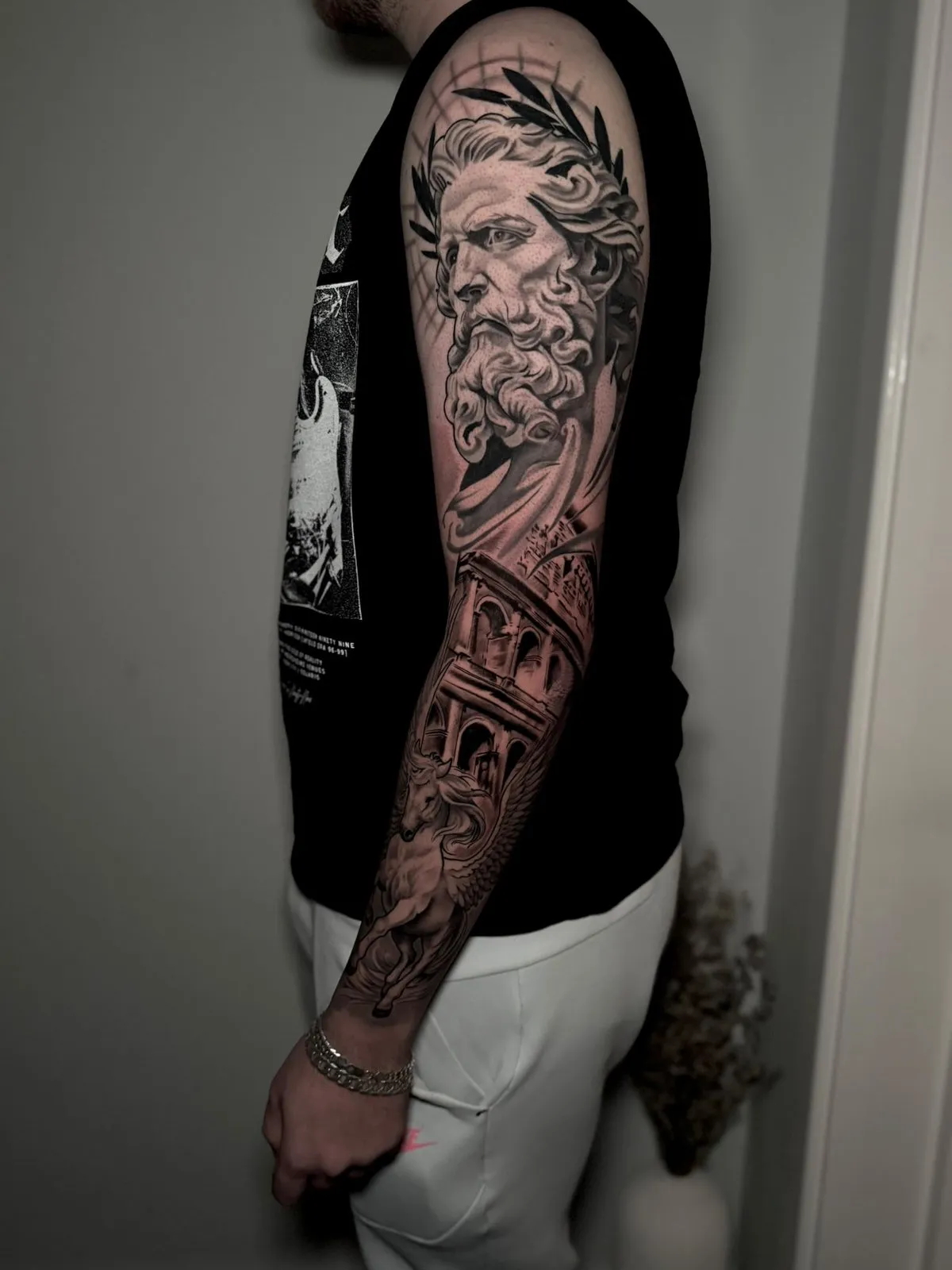 Black and grey Greek god statue full sleeve with Colosseum and Pegasus, by Cameron at Shade Studio Peterborough