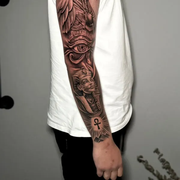 Egyptian full sleeve with Horus, the Eye of Horus, a pharaoh and an ankh, black and grey by Cameron at Shade Studio Peterborough