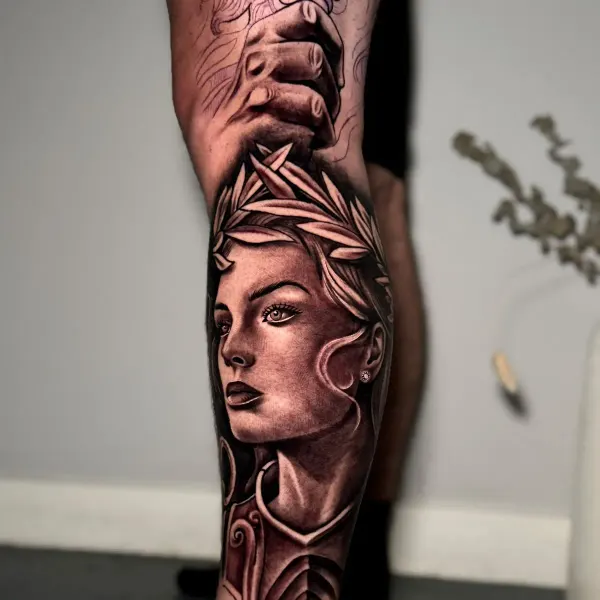 Black and grey goddess portrait with laurel wreath, calf tattoo by Cameron at Shade Studio Peterborough