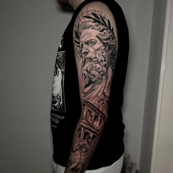 Black and grey Greek god statue full sleeve with Colosseum and Pegasus, by Cameron at Shade Studio Peterborough