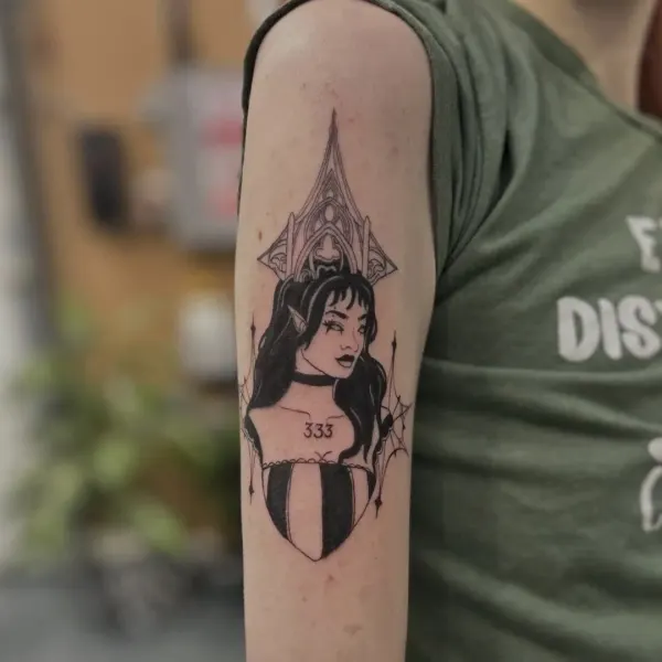 Blackwork gothic vampire portrait with cathedral arch, cobwebs and corset, upper arm tattoo by Madi at Shade Studio Peterborough