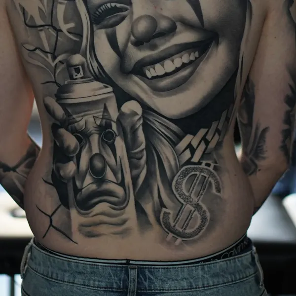 chicano clown-face woman spraying graffiti, full back piece with a dollar sign