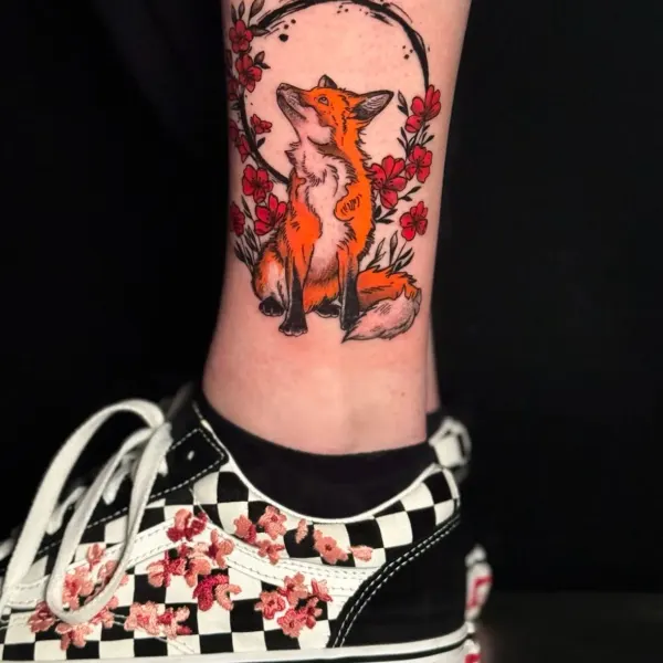 Fox with cherry blossom and brushstroke circle, colour ankle tattoo by Karolina at Shade Studio Peterborough