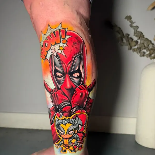 Deadpool and Wolverine comic style colour tattoo with speech bubble, calf by Raf at Shade Studio Peterborough