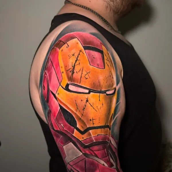 Colour realism Iron Man helmet, upper arm tattoo by Raf at Shade Studio Peterborough
