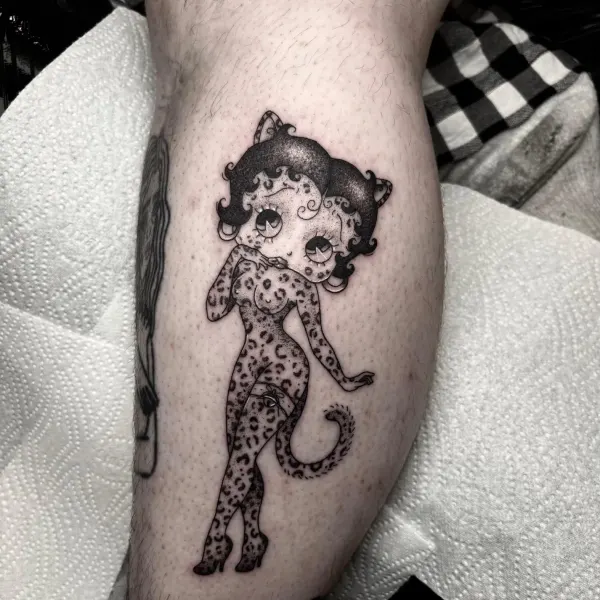 Stipple shaded Betty Boop with leopard print, calf tattoo by Ashlee at Shade Studio Peterborough